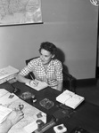 Mrs. Ann Counts sitting at an office desk
