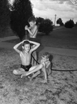 Children playing with water hose