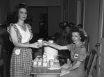 Blood Donor center. Miss Maria M. Bickerstaff, 21, Convair worker, 25,000th blood donor