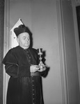 Saint Patrick's Catholic Church. Messanger J. G. O'Donohoe, pastor, holding an antique chalice