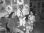 Texas Christian University (TCU) opening. Professor Paul Dinkins, left, discusses courses with Apprentice Seaman Raymond Scales and Shirley Glascock