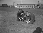 Playing marbles are Masonic Home residents C. O. Wilkie, left, and Sidney Feeler by Tom Dillard