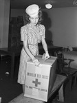 Red Cross. Gift packing. Mrs. W. H. Wright, sealing a carton