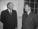 University of Texas President Homer P. Rainey, left, talks to Elden B. Busby