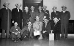 Newspaper writers and officials of General Tire and Rubber Company with Amon Carter