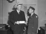 L. B. Clements presenting check to Captain Howard C. Maddox
