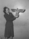 Mrs. K. G. Thorpe holding Nazi emblem