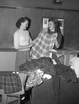 Misses Christine Woolf and Marcia Lea McAuley, shown with clothes they collected for Greek war sufferers