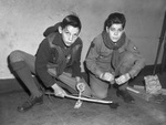 Boy Scouts demonstrating methods of starting a fire