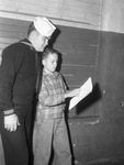 Coxswain Billy E. McCurry, with Jimmy Haggard of the Panther Boys Club.