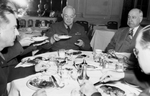 General H. H. Arnold, chief of Army Air Forces, at breakfast. At right is Amon Carter Senior