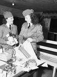 Texas Guardettes. Monette Gustafson and Larry Dameron, preparing gifts