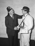 Shrine Ring Candidate winner, Jack A. Burge, right, receiving congratulations from Potentate Champ Clark