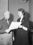 Mrs. Sammie T. Warren receiving service award from Colonel Herbert Baldwin