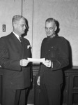 Salvation Army. Leo Potishman, presenting $15,000 check to Brigadier Ray Gearing, Texas Division Commander of the Army