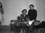 Salvation Army. Mrs. M. E. Porter, at the machine, being directed by Mrs William Johnson.