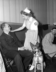 Mrs. E.T. Stearns with Arthur Corbitt and his seeing-eye dog
