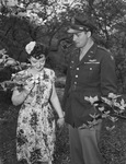 Easter Sunday. Miss Dorothy Burke and Lieutenant Quentin Poe, Fort Worth Army Air Field, looking at dogwood blossoms