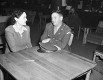 Mrs. Ann Nichols talking to Pvt. Thornton Black