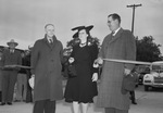 East Lancaster opening of South artery. The ribbon cutting, showing Mrs. John Morris, member of the civic league; at the left is C. W. Atkinson, and T. C. Jone, Chamber of Commerce highway committee chairman.