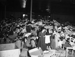 Used clothing collection. I. C. Parker, left, and Mrs. T. J. W. Shoemaker and Miss Frances Yeiser