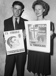 Blanche Schrickel, Arlington North Texas Agricultural College (NTAC) student, and Robert Gossett, Carter-Riverside High School student, shown with posters