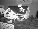 Miniature house on display at the Lumbermen's Association of Texas convention