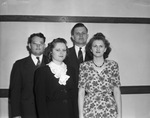 Reverend David Sperring and Reverend William Hal Hunter, shown with their wives, Mrs. Sperring and Mrs. Hunter