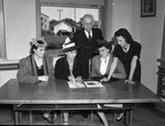 Left to right, Mrs. Dale D. White, Riderside High School; Mrs. W. E. Gracy, Poly High School; Mrs. Craig Laine, Arlington Heights and Lucille Gracy, Poly High School. Colonel E. D. Crites is standing