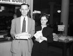 War bonds selling contest leaders. Monnig's Juantia Mills of the cosmetics department and C. T. Hickman of the receiving department