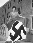 Miss Gene Bridwell Smith, shown with Nazi flag
