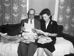 O. F. Newman and daughter Mrs. C. L. Brown reading Corporal Newman's mail