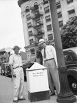 City cleanup campaign. Lacy, City Disposal Superintendent, left, and Hester, City Street Superintendent, looking at trash can