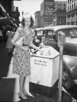 Miss Novelle Roberts, demonstrating proper technique in keeping city clean
