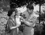 Sergeant Ray McKinley and Mrs. F. A. Moor and son, Bobby
