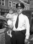 Little Glenda Loretha Martin shown with Patrolman Freeman
