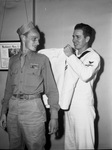 William J. Mack, discharged Army man who enlisted in the Navy (left) and Carl Childs, Navy Yoeman First Class