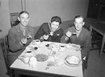 Servicemen eating Thanksgiving meal at SMC