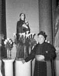 Saint Patrick's Catholic Church. New Statues. Monsignor Joseph O' Donohoe standing in front of a new statue of Saint Gemma Galgani