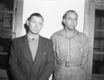 War worker Thomas B. Hipps (left), veteran with unidentified man