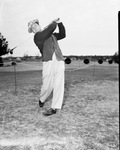 Golfer Jimmy Demaret in action