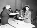 Miss Berneta Minkwitz serving meal at SMC