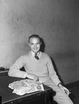 Lee R. King, former aviation machinist mate first class, shown with part of the $58,00 in Chinese currency he brought home from the Pacific theater.