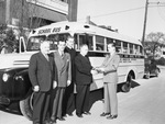 Laneri Catholic High School for Boys Boosters Club President Joe Breen, right, presents Reverand A. Schmitt with certificate of ownership of a school bus.