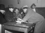 United Packinghouse Workers of America union field representative L. R. Hoover, right, gives instructions to, left to right: Sanford Rawle; James Stokes and Oscar Erlanson, picketers.