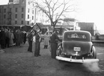 Striking United Packinghouse Workers of America union members check cars going through their picket line.