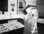 Kathryn Knopp and Phillip Webster, De Zavala Elementary School students, examining butterflies