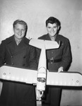 Private First Class George Goldberg, left, and Private Tom MacConchie, right, with airplane model