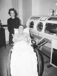 William Beaty, infantile paralysis (polio) patient, with his mother, Mrs. Faye Beaty
