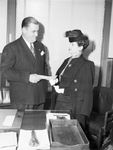 Mrs. Harry Wandry receiving prize from Frank Weatherford